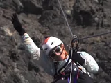 Participant descending on the zip line at the end of the Estancia Bonanza via ferrata